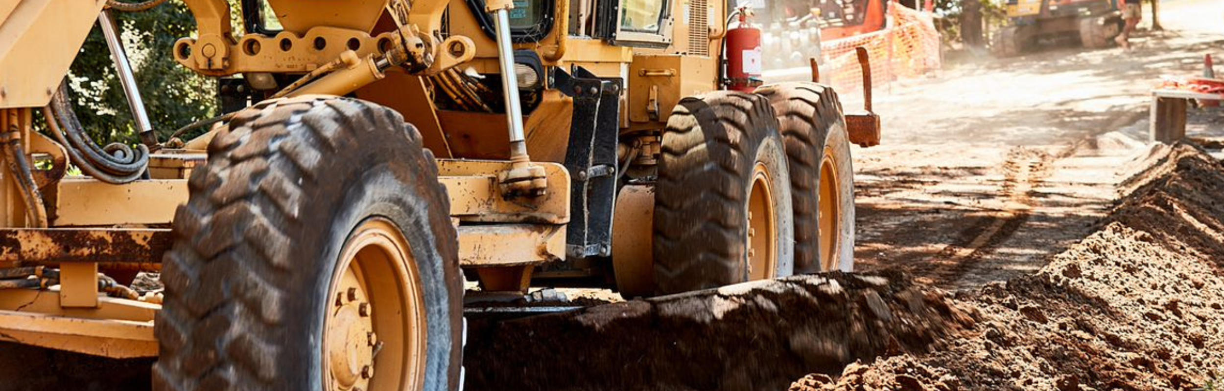 large machinery pushing dirt