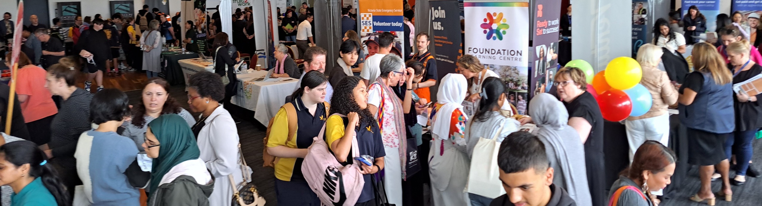 group of people attending an expo about jobs